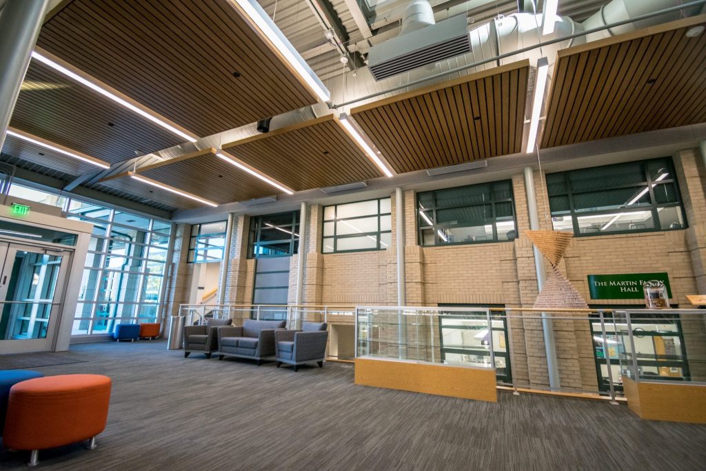 continuous linear wood ceiling with a stained white maple veneer