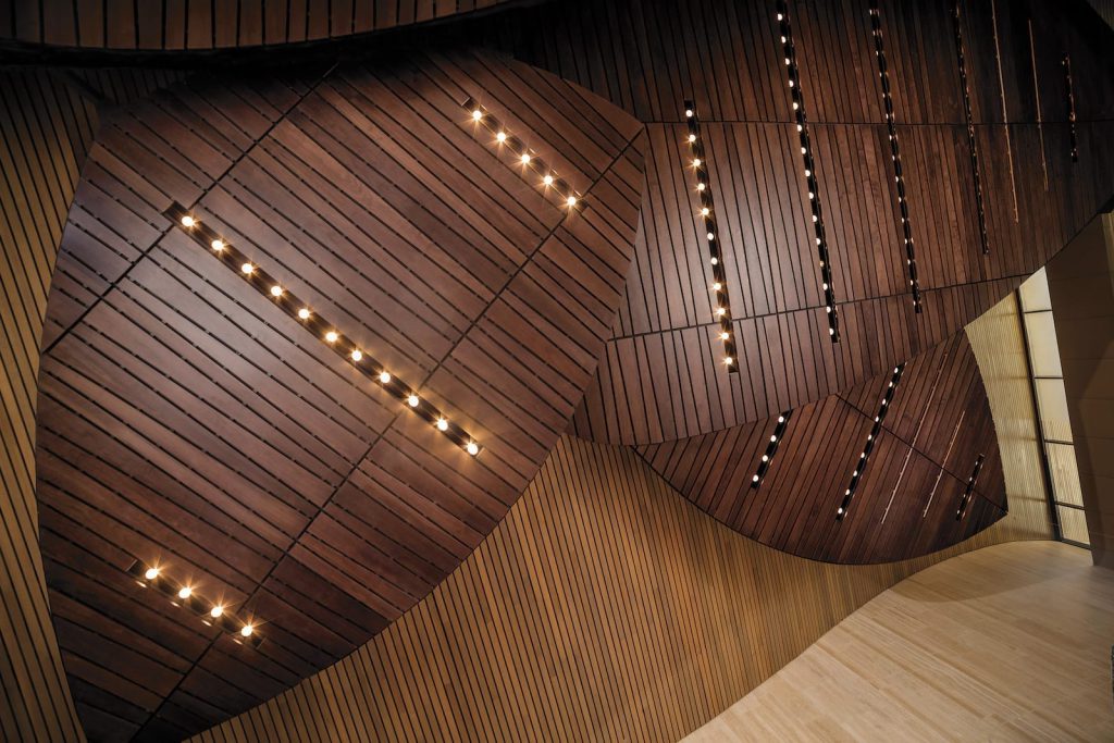 economical wood ceiling option with a continuous linear with a stained veneer