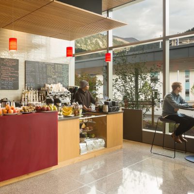 9Wood's 1100 Cross Piece Grill in Solid Western Hemlock with Stain at Alaska State Library, Archives and Museum, Juneau, Alaska. Hacker Architects. Photo: Lara Swimmer. The coffee and snack bar features a wood grille ceiling suspension. Photo: Lara Swimmer.