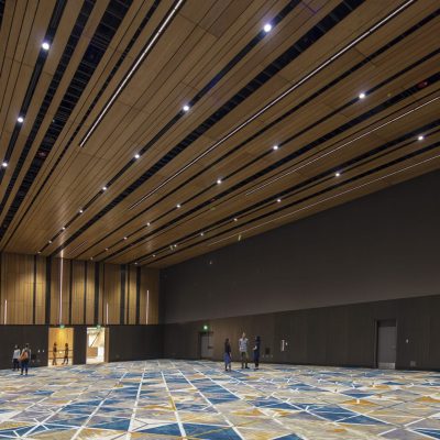 9Wood's 2100 Panelized Linear at the Hyatt Regency Seattle in Seattle, Washington. LMN Architects. The panels — 493 ceiling panels and 339 wall panels — are made with 3/4-in. plain sliced white oak veneered wood. The wood members have various widths, and the panels themselves vary in width and length. The effect is to create a unique pattern and feel, what the architect calls a “woven wood basket.”