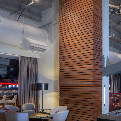 9Wood's 2300 Continuous Linear in White Oak Veneer with stain at State Farm Arena in Atlanta, Georgia. HOK. The subcontractor, Anning-Johnson, mitered perfect corners for a bump-out wall. The architect wanted to apply resources to where it mattered and appealed to fans.