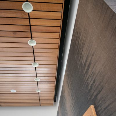 Lighting integration is crucial for linear wood ceilings. While acoustic subcontractors are skilled in installing to specification, nearly all lighting and MEP can integrate with a wood ceiling or a linear wood ceiling for that matter.