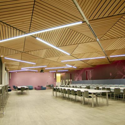 9Wood 2100 Panelized Linear in Solid Western Hemlock with Clear Finish at Jazz Pharmaceuticals, Palo Alto, California. STUDIOS Architecture. Air diffusers, linear lighting and downlight fixtures are featured throughout the ceiling. In some places, the light fixtures are 12 feet in length, but the channel is only 10 feet long. “We had to hook channels together,” says Rudy Vargas, senior project manager at Ad-In Inc.