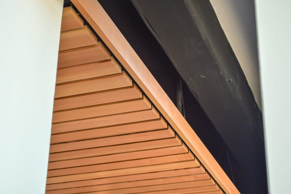 Panelized linear wood ceilings can be identifed by the gap between the individual members.