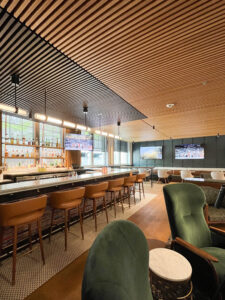 http://The%209Wood%201100%20Cross%20Piece%20Grille%20in%20White%20Oak%20Veneer%20with%20Custom%20Stain%20in%20an%20education%20setting.