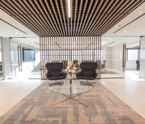 http://The%209Wood%201800%20True%20Access%20Grille%20Ceiling%20in%20Walnut%20Veneer%20in%20an%20office%20lobby%20setting.