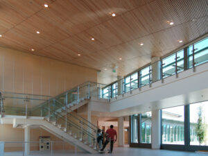 http://The%209Wood%201200%20Dowel%20Grille%20in%20Solid%20Western%20Hemlock%20and%20a%20Maple%20Finish%20at%20a%20school%20featuring%20can%20lighting.