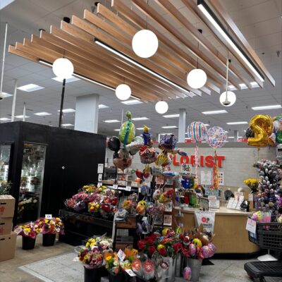 The 9Wood 1500 Baffle in White Oak Veneer in a retail setting.