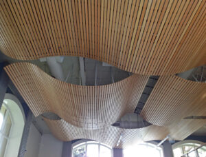 http://The%209Wood%208200%20Linear%20Wood%20Wave%20in%20Solid%20Western%20Hemlock%20help%20to%20hide%20HVAC%20systems%20in%20the%20plenum%20in%20a%20Construction%20Office.