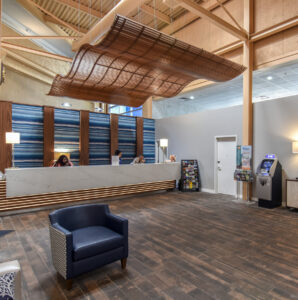 http://9Wood's%208100%20Wave%20Grille%20in%20Solid%20Western%20Hemlock%20with%20a%20Teak%20Stain%20in%20a%20Hospitality%20setting.
