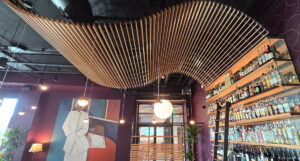 http://9Wood's%208100%20Wave%20Grille%20in%20Solid%20Western%20Hemlock%20in%20a%20restaurant%20hospitality%20setting.