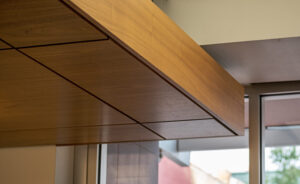 http://9Wood%200100%20Trim%20in%20Walnut%20Veneer%20frames%20a%204500%20XL%20Channel%20Tile%20ceiling%20cloud.
